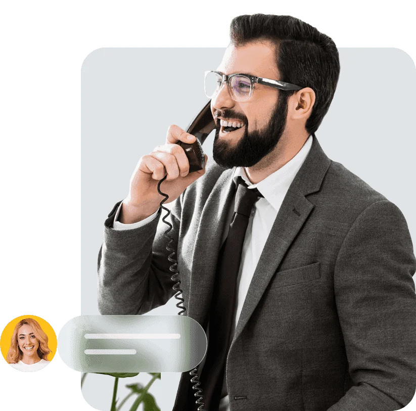 Business owner smiling on a desk phone call